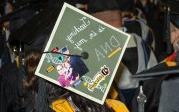 To stand out amid a sea of caps and gowns, some graduating students decorated their mortarboards with messages, images and even 3D creations. Photo Chuck Thomas/ODU